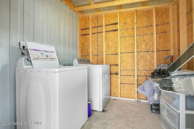 laundry area with washing machine and clothes dryer