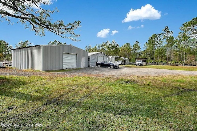 view of outbuilding featuring a yard and a garage