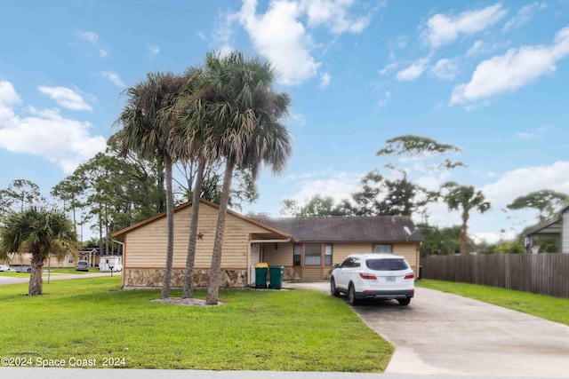 ranch-style home with a front yard