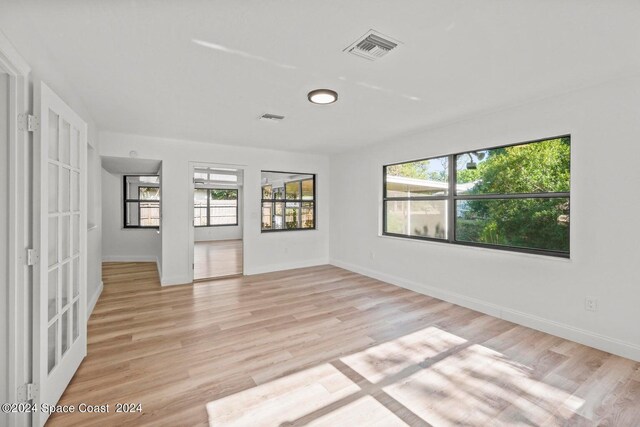 unfurnished room with light hardwood / wood-style flooring