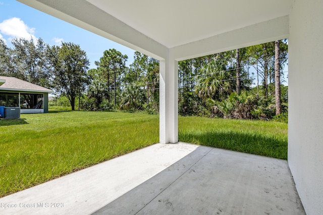 view of yard with a patio and central AC unit