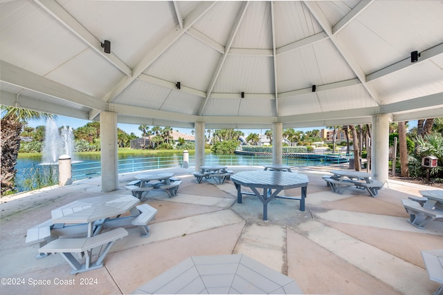 view of patio / terrace with a water view and a gazebo