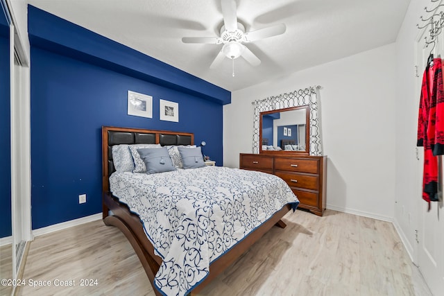 bedroom featuring light wood-type flooring and ceiling fan