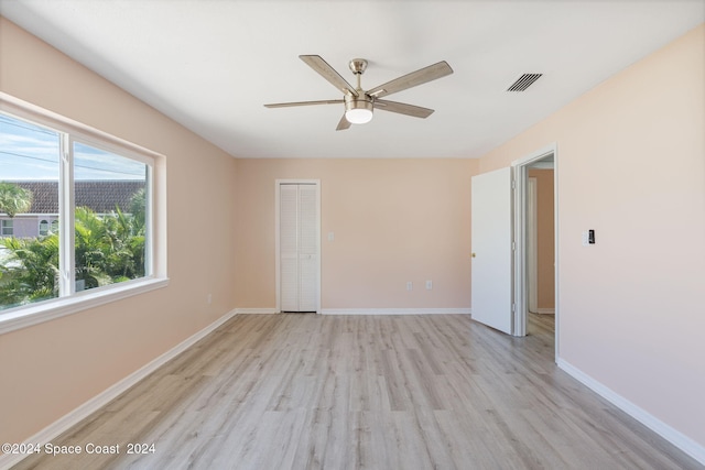 spare room featuring ceiling fan and light hardwood / wood-style floors