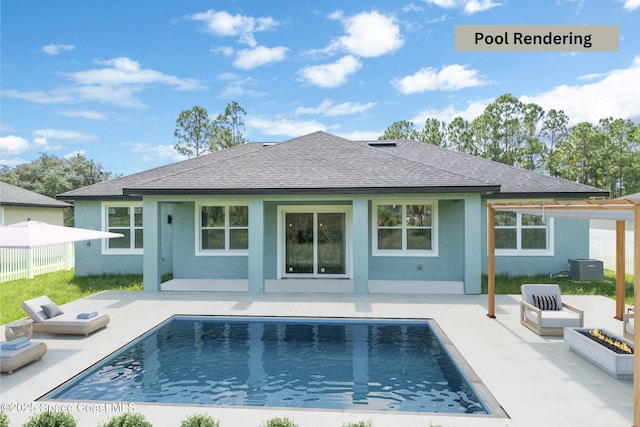 rear view of property with central AC unit, a patio area, and an outdoor fire pit