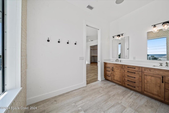 bathroom featuring vanity and wood-type flooring