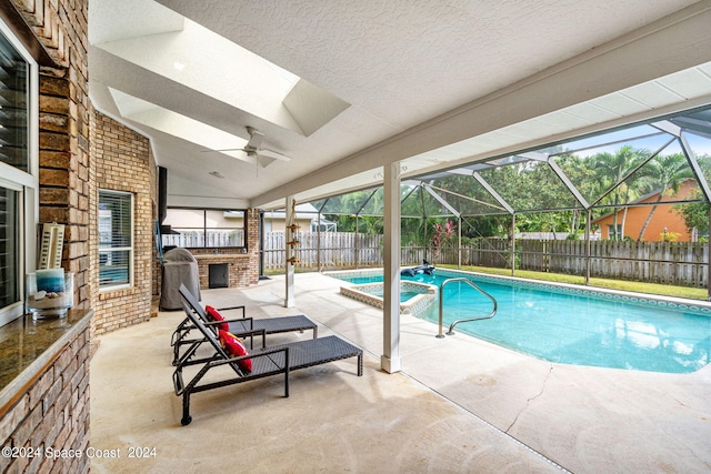 view of swimming pool with a lanai, a patio, and ceiling fan