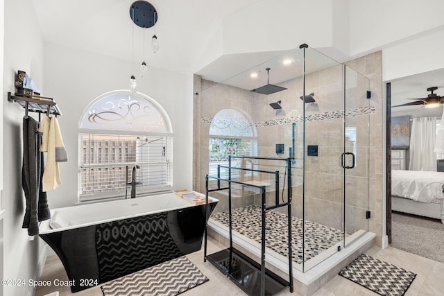 bathroom featuring tile patterned flooring, ceiling fan, and plus walk in shower