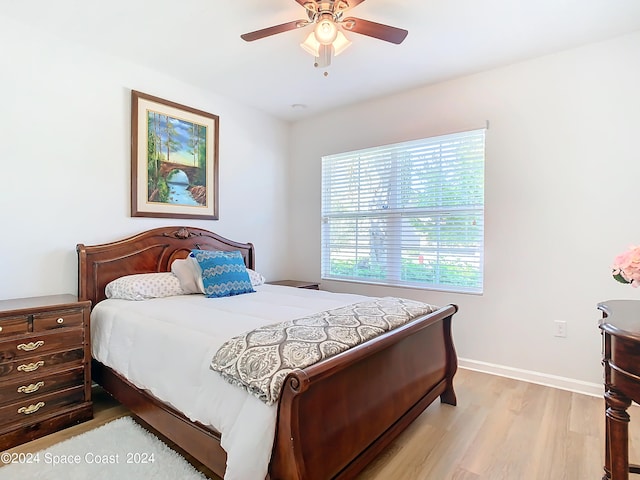 bedroom featuring light wood-type flooring and ceiling fan