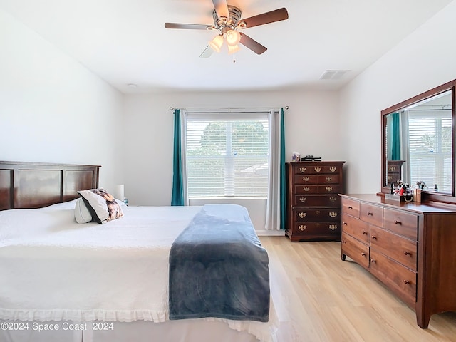 bedroom featuring ceiling fan and light hardwood / wood-style flooring