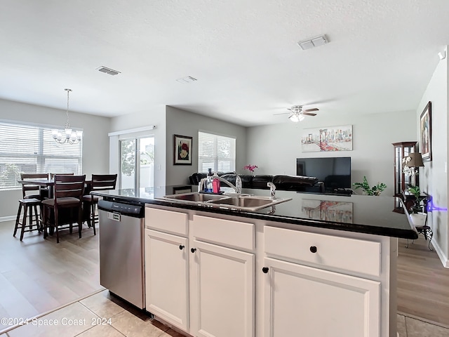 kitchen with sink, white cabinetry, dishwasher, ceiling fan with notable chandelier, and light hardwood / wood-style floors