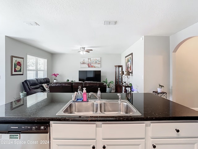 kitchen with white cabinetry, dishwasher, a textured ceiling, ceiling fan, and sink