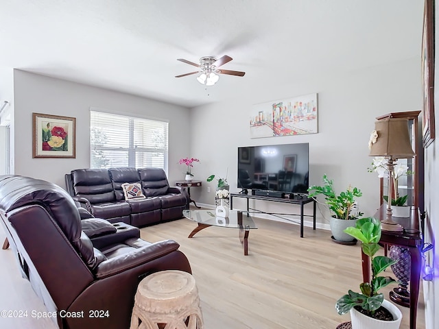 living room with light hardwood / wood-style floors and ceiling fan