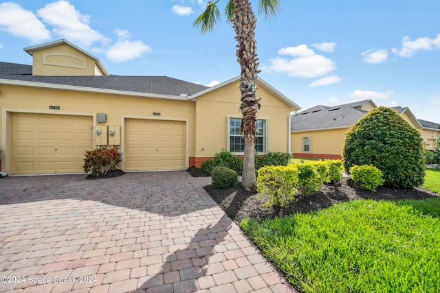 view of front of home with a garage