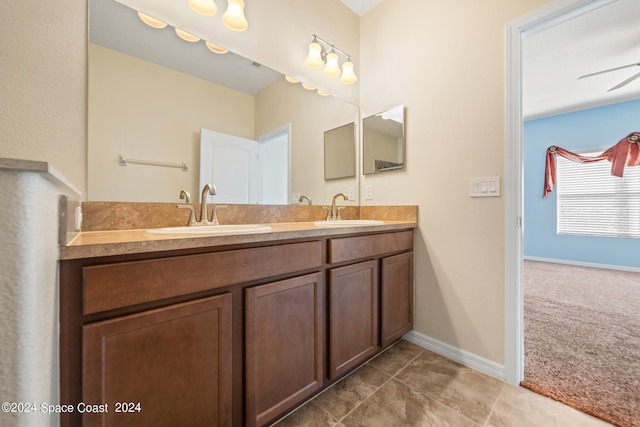 bathroom featuring ceiling fan, tile patterned flooring, and vanity