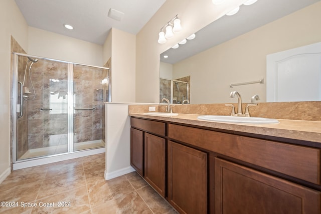 bathroom with vanity and walk in shower