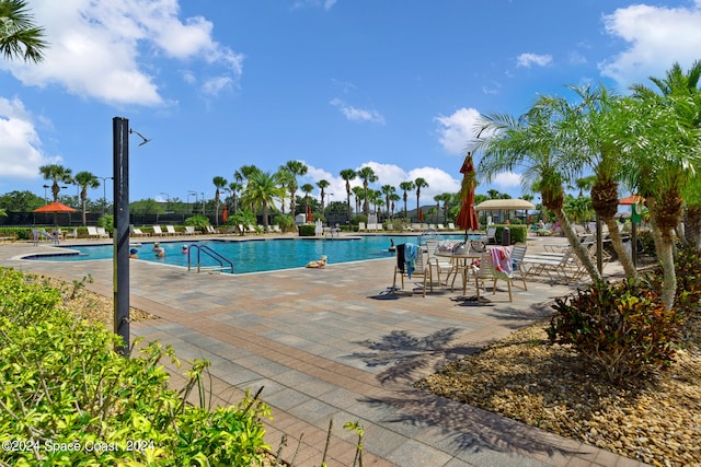 view of swimming pool featuring a patio area