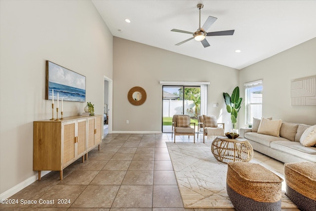 tiled living room with high vaulted ceiling and ceiling fan