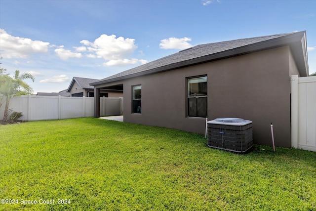 view of yard with central AC