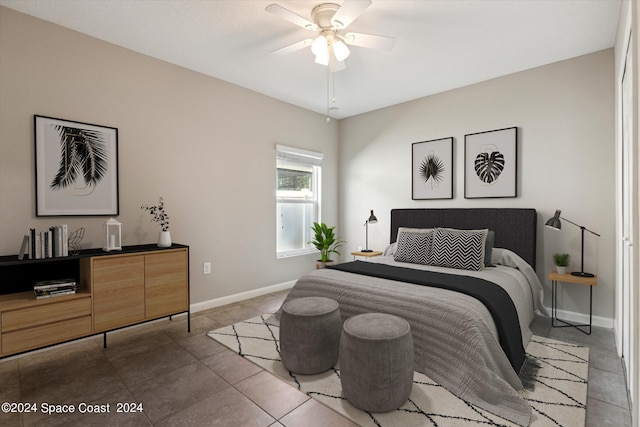 bedroom featuring tile patterned floors and ceiling fan