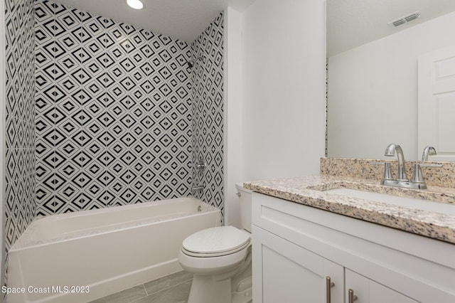 bathroom with bathtub / shower combination, visible vents, toilet, and vanity