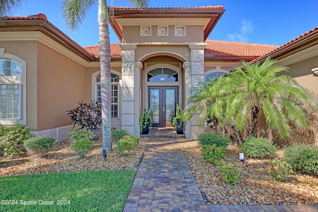 entrance to property featuring french doors