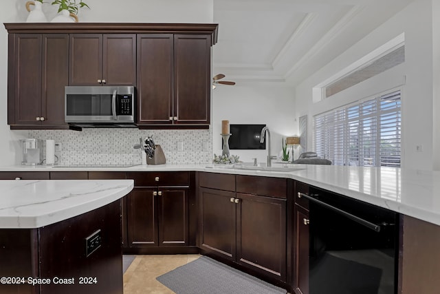 kitchen with backsplash, dark brown cabinets, ceiling fan, ornamental molding, and sink