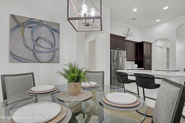 dining area with an inviting chandelier