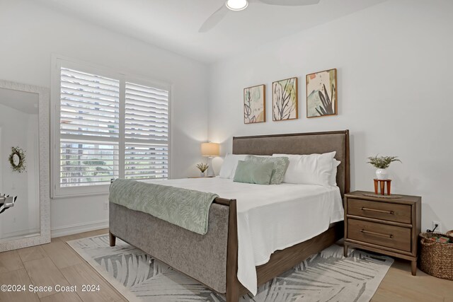 bedroom featuring ceiling fan and light hardwood / wood-style floors