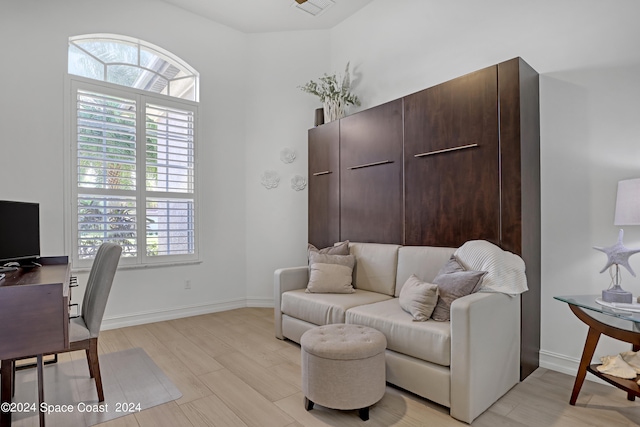 office with light hardwood / wood-style floors