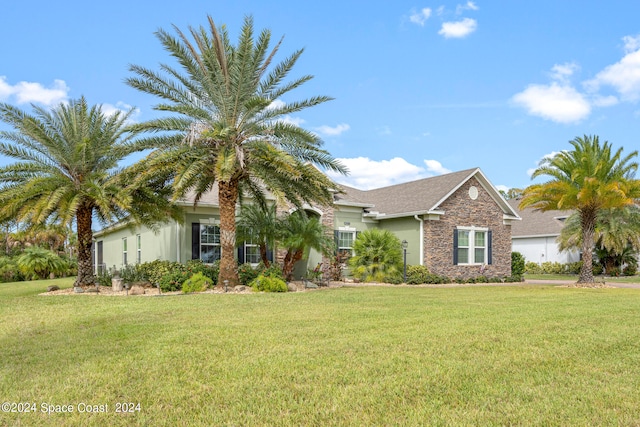 obstructed view of property featuring a front lawn