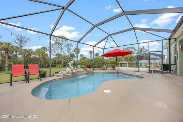 view of pool with a lanai, a patio, and pool water feature