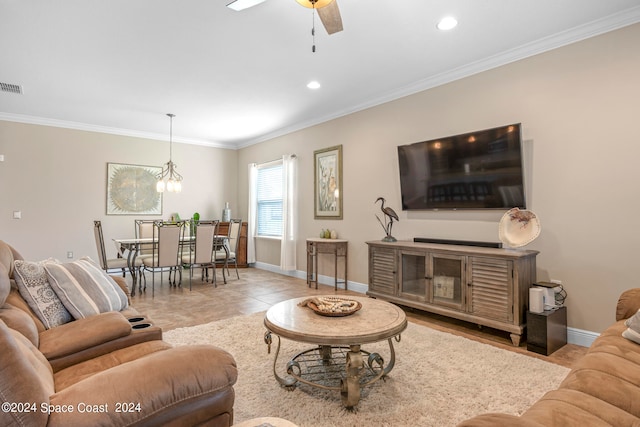 tiled living room featuring ceiling fan with notable chandelier and ornamental molding