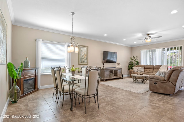 dining area featuring ornamental molding, ceiling fan, and plenty of natural light