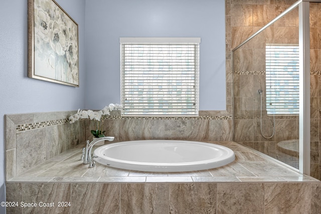 bathroom with independent shower and bath