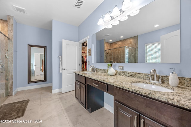 bathroom with vanity, tile patterned floors, and an enclosed shower