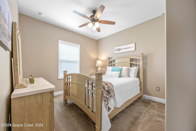 bedroom with ceiling fan and carpet floors