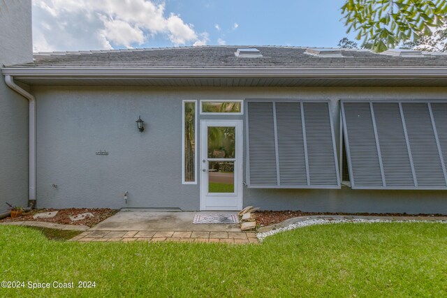 rear view of house with a yard