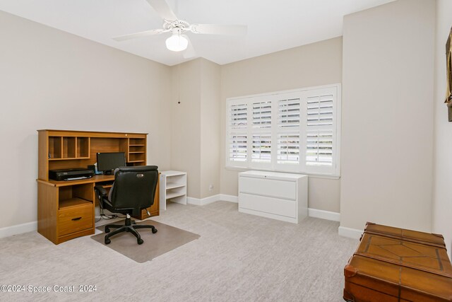 carpeted home office with ceiling fan