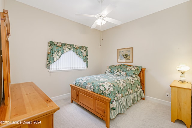 bedroom with ceiling fan and carpet flooring