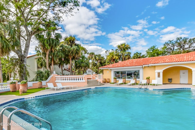 view of swimming pool with a patio area