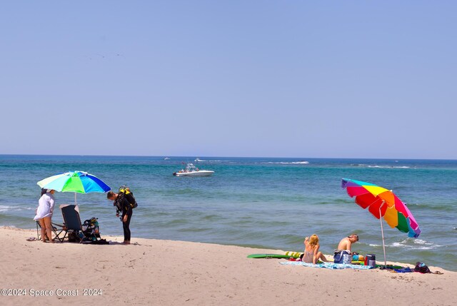 property view of water featuring a beach view