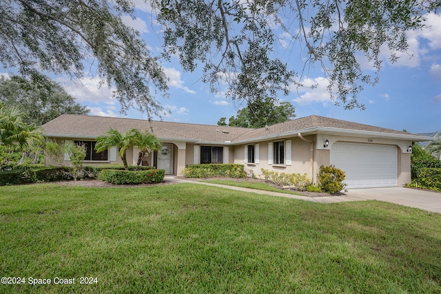 single story home with a garage and a front yard