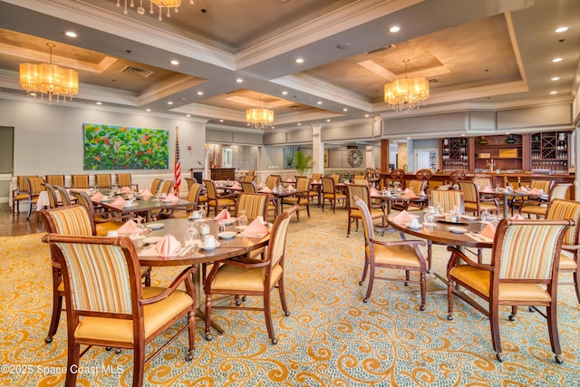 dining room with crown molding, a notable chandelier, and a tray ceiling