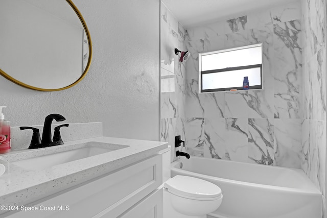 full bathroom featuring vanity, toilet, and tiled shower / bath