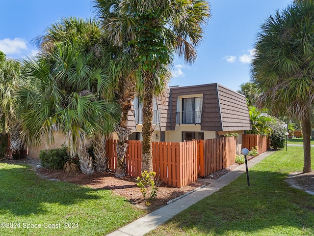 view of front of home with a front yard