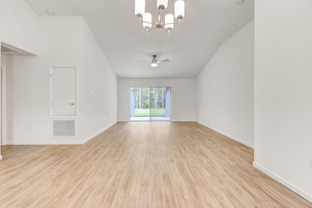 unfurnished living room with ceiling fan with notable chandelier and light hardwood / wood-style flooring