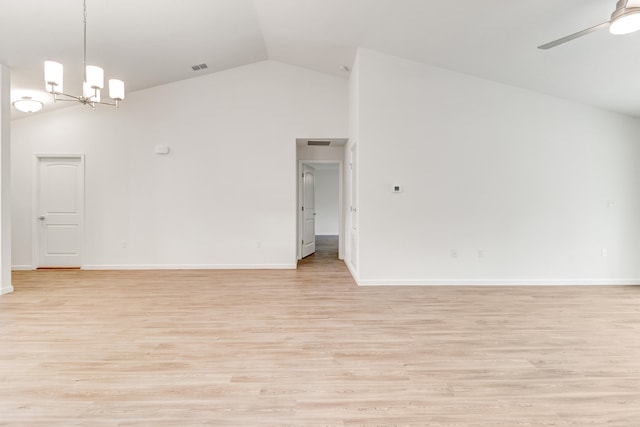 unfurnished room with light hardwood / wood-style flooring, high vaulted ceiling, and ceiling fan with notable chandelier