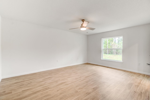 unfurnished room featuring ceiling fan and light hardwood / wood-style flooring