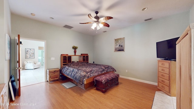 bedroom featuring light hardwood / wood-style flooring and ceiling fan